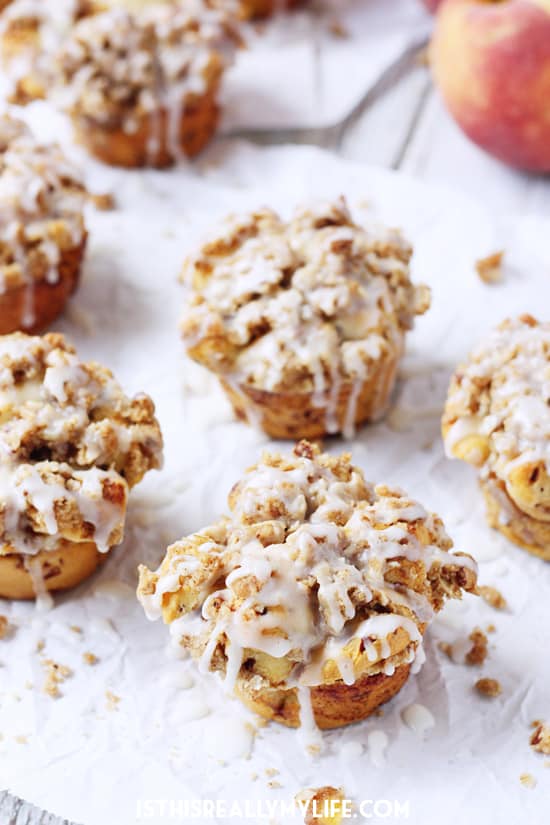 Peach Crisp Monkey Bread Muffins -- These peach crisp monkey bread muffins combine fresh, diced peaches, a delicious crumble topping and cinnamon roll dough for an easy, scrumptious treat! | halfscratched.com