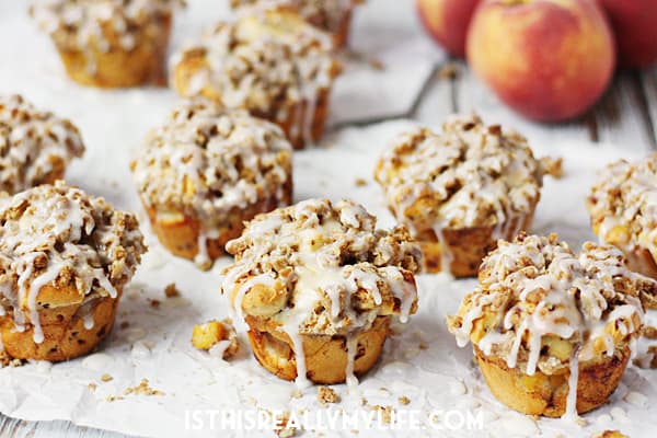 Peach Crisp Monkey Bread Muffins -- These peach crisp monkey bread muffins combine fresh, diced peaches, a delicious crumble topping and cinnamon roll dough for an easy, scrumptious treat! | halfscratched.com