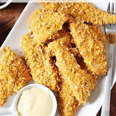 Baked Chicken Fingers - Corn flakes and spices are the secret to these healthy baked chicken fingers with homemade honey mustard. This recipe is totally kid tested and approved! | halfscratched.com