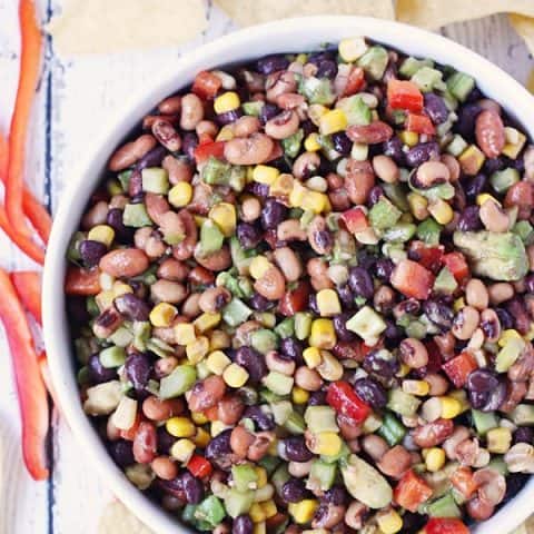 Cowboy Caviar - Cowboy caviar (a.k.a. cowboy salsa) is perfect for feeding a large crowd on Cinco de Mayo, Taco Tuesday or any day calling for amazing chips and salsa! | halfscratched.com