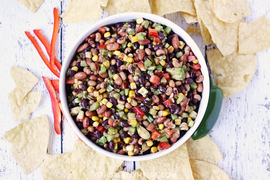 Cowboy Caviar - Cowboy caviar (a.k.a. cowboy salsa) is perfect for feeding a large crowd on Cinco de Mayo, Taco Tuesday or any day calling for amazing chips and salsa! | halfscratched.com