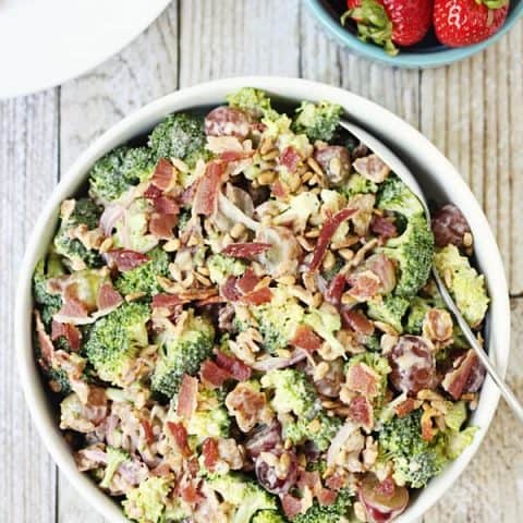 Creamy Bacon Broccoli Salad -- This creamy bacon broccoli salad is one of the best broccoli salads I've tasted. It features bacon, grapes, sunflower seeds and a creamy low-fat dressing. | halfscratched.com