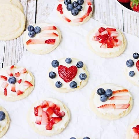 Mini Fruit Pizzas -- Mini fruit pizzas are a fun and festive dessert for the 4th of July or any celebration! Top them with berries, diced kiwi...even mandarin oranges! | halfscratched.com