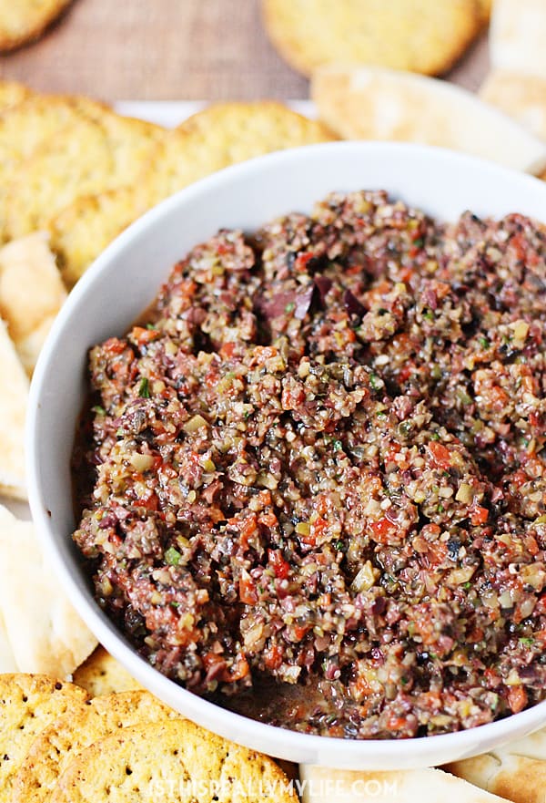 Triple Olive Tapenade -- This triple olive tapenade features Kalamata, green & California olives. Freshly roasted red bell pepper, garlic & Italian herbs makes it extra addictive! | halfscratched.com