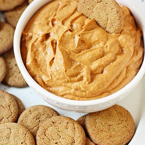 Easy Fluffy Pumpkin Dip -- This pumpkin dip is full of pumpkin spice flavor and super easy to make. It is so creamy, fluffy and yummy you'll want to serve it at every holiday party! | halfscratched.com #pumpkin #recipe