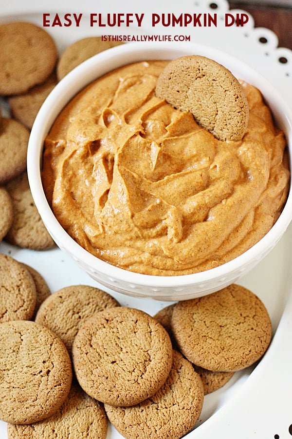 Easy Fluffy Pumpkin Dip -- This pumpkin dip is full of pumpkin spice flavor and super easy to make. It is so creamy, fluffy and yummy you'll want to serve it at every holiday party! | halfscratched.com #pumpkin #recipe