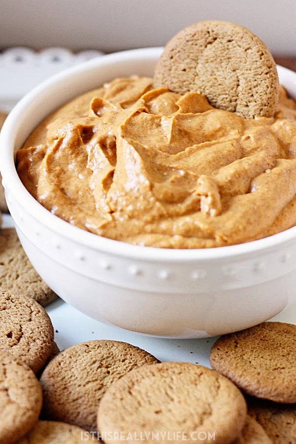 Easy Fluffy Pumpkin Dip -- This pumpkin dip is full of pumpkin spice flavor and super easy to make. It is so creamy, fluffy and yummy you'll want to serve it at every holiday party! | halfscratched.com #pumpkin #recipe