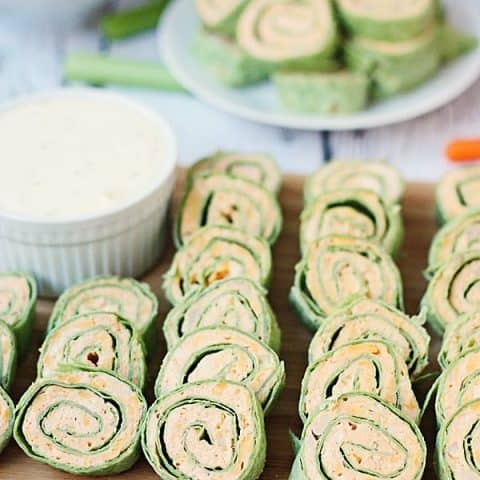 Buffalo Chicken Pinwheels -- Buffalo chicken pinwheels are a total crowd pleaser thanks to cream cheese, buffalo sauce and shredded rotisserie chicken. | halfscratched.com