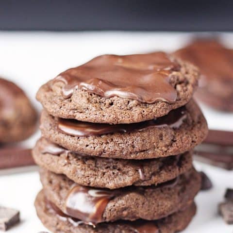 Quadruple chocolate grasshopper cookies -- rich chocolate cookies packed with chocolate chips and dark chocolate chunks and topped with Andes mint candies. | halfscratched.com