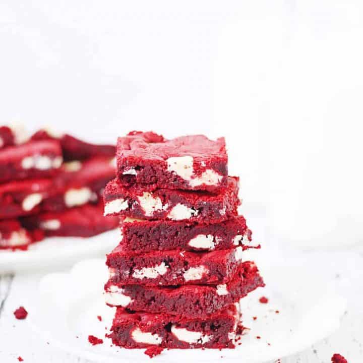 Red Velvet Cake Mix Bars -- Red velvet cake mix bars require only five ingredients and five minutes to throw together. They're soft, chewy and all kinds of white chocolatey Perfect for Valentine's Day! | halfscratched.com #redvelvet #recipe #cookies