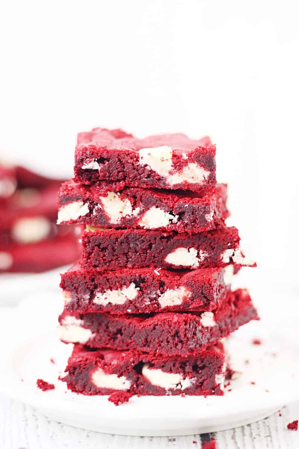 Red Velvet Cake Mix Bars -- Red velvet cake mix bars require only five ingredients and five minutes to throw together. They're soft, chewy and all kinds of white chocolatey Perfect for Valentine's Day! | halfscratched.com #redvelvet #recipe #cookies