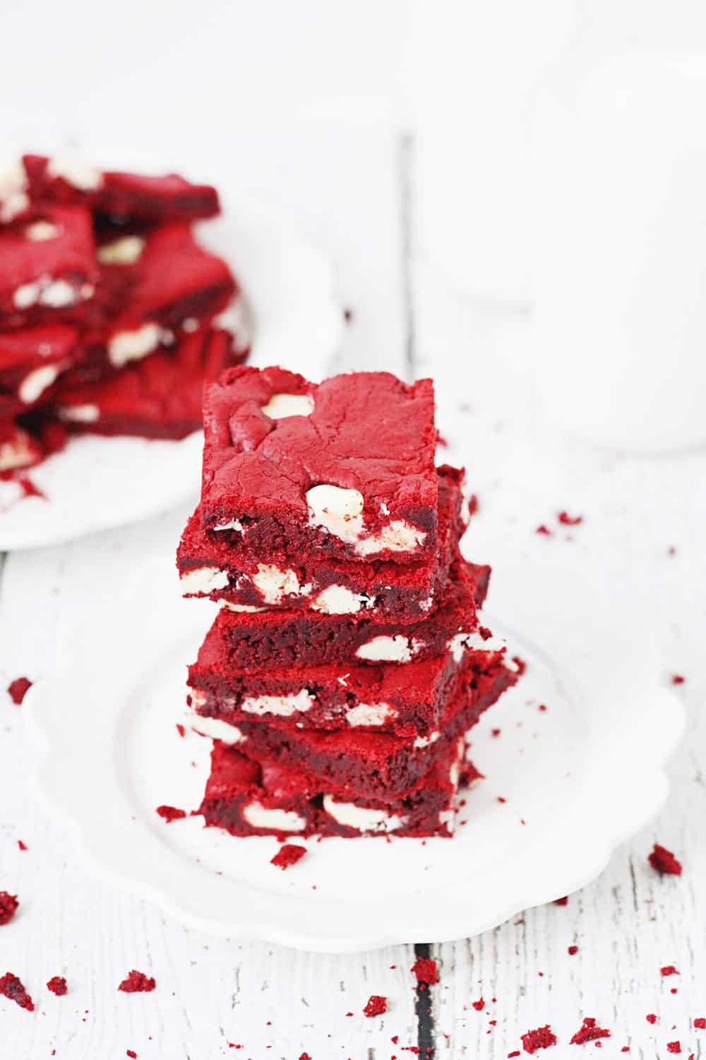 Red Velvet Cake Mix Bars -- Red velvet cake mix bars require only five ingredients and five minutes to throw together. They're soft, chewy and all kinds of white chocolatey Perfect for Valentine's Day! | halfscratched.com #redvelvet #recipe #cookies