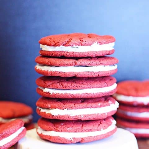 Red Velvet Oreo Cookies -- Red velvet oreo cookies are always a huge hit at parties and family get-togethers. Easy to make but looks like you slaved all day! | halfscratched.com #cookies #redvelvet #oreo