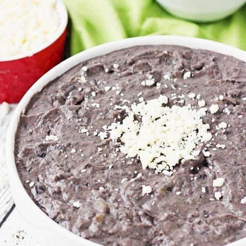 Slow Cooker Refried Black Beans -- These slow cooker refried black beans are so good, you'll want to make them every Taco Tuesday. Good thing they're easy and require only a handful of ingredients! | halfscratched.com #slowcooker #crockpot #mexican