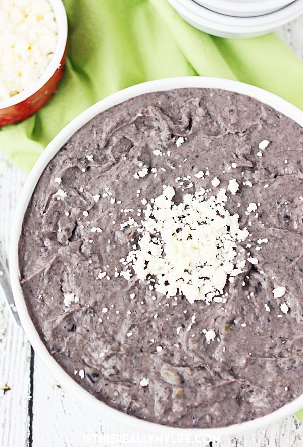 Slow Cooker Refried Black Beans -- These slow cooker refried black beans are so good, you'll want to make them every Taco Tuesday. Good thing they're easy and require only a handful of ingredients! | halfscratched.com #slowcooker #crockpot #mexican