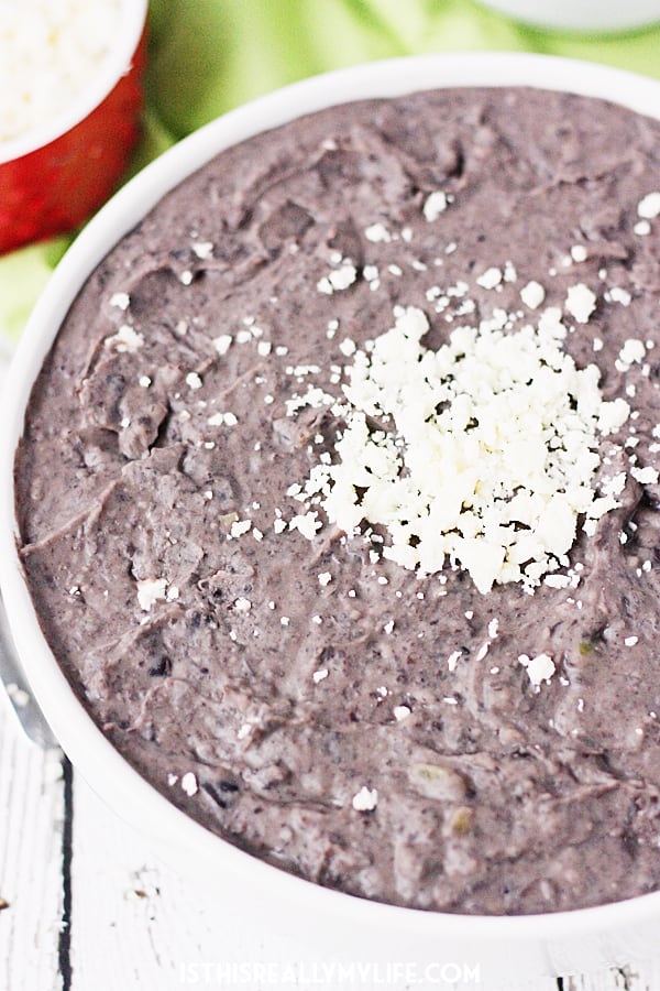 Slow Cooker Refried Black Beans -- These slow cooker refried black beans are so good, you'll want to make them every Taco Tuesday. Good thing they're easy and require only a handful of ingredients! | halfscratched.com #slowcooker #crockpot #mexican