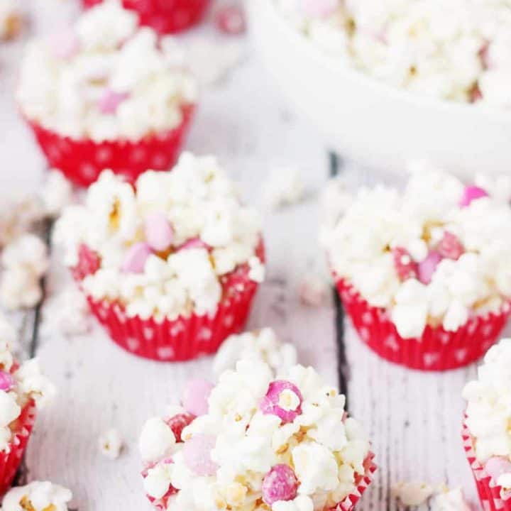 3-Ingredient Valentine's Popcorn Balls -- Valentine's popcorn balls are a super fun treat to serve at your Valentine's parties. With only three ingredients, they're super quick and easy to make! | halfscratched.com #valentinesday #recipe #popcorn
