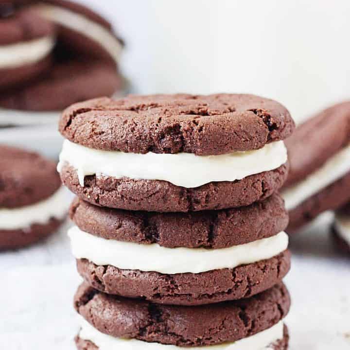 Cake Mix Oreo Cookies -- Cake mix Oreo cookies are a soft, chewy, delicious alternative to the store-bought variety. Devil's food cake mix makes them extra fudgy and an easy cream cheese frosting seals this sandwich deal! | halfscratched.com #cookie #recipe #dessert