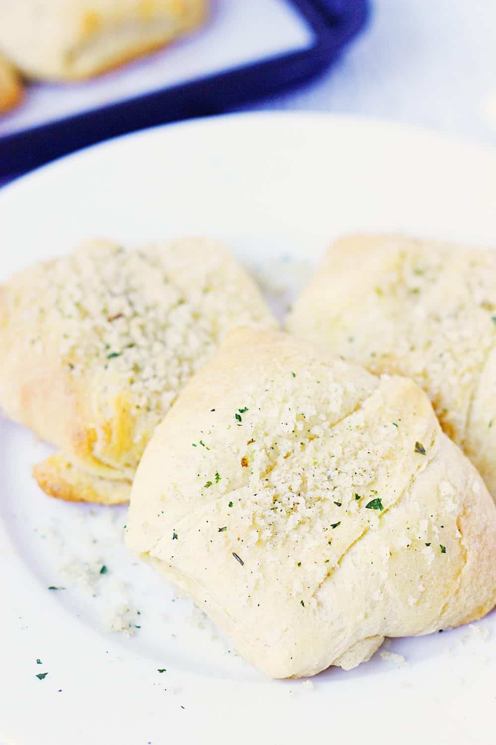 Creamy Chicken Crescent Rolls -- Creamy chicken crescent rolls are a family favorite. Flaky crescent roll dough is filled with a creamy chicken mixture and topped with melted butter and seasoned bread crumbs. Plus you can freeze the leftovers! | halfscratched.com #recipes #easyrecipe #chicken