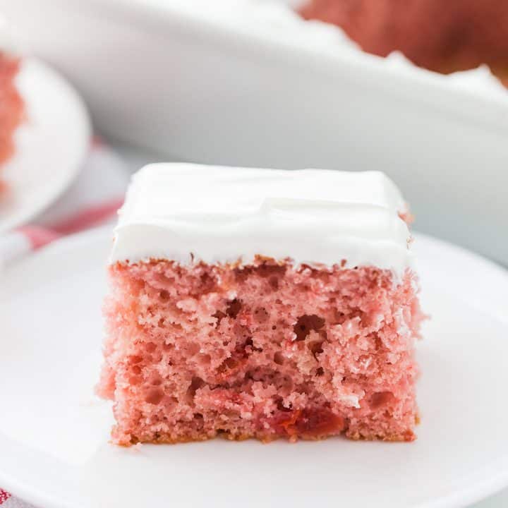 Easy Cherry Cake - Easy cherry cake with whipped topping is unbelievably delicious and requires only a white cake mix, cherry pie filling, and a few other ingredients. Whipped topping frosting is the finishing touch! #cherry #cherrycake #cakemix #cake #baking #sweets #dessert #halfscratched