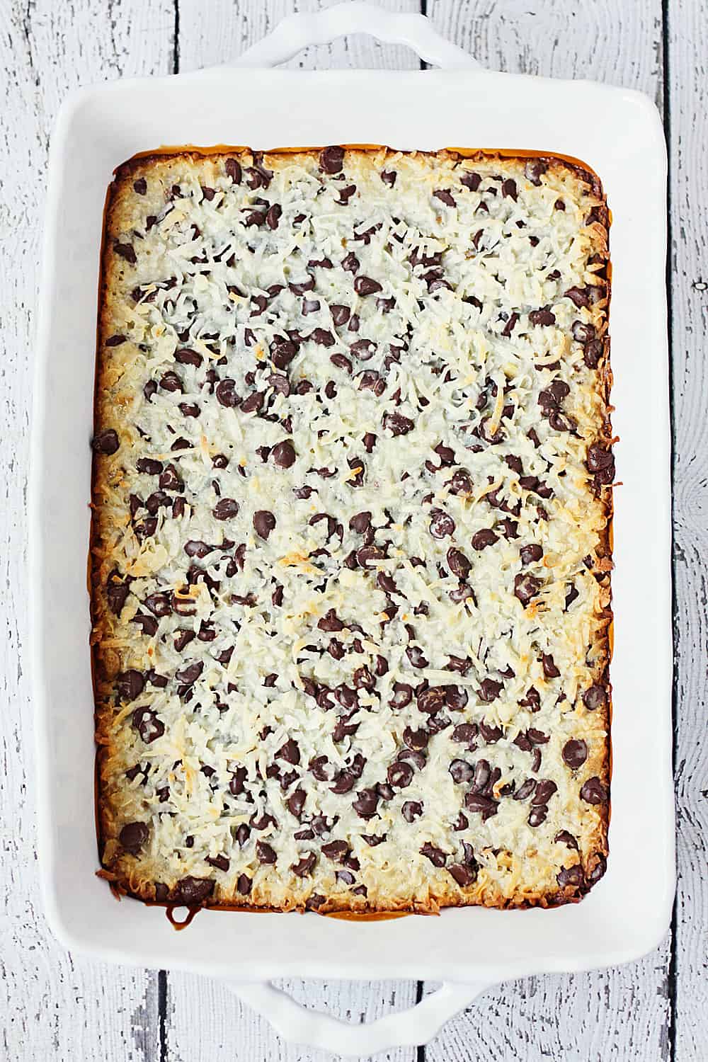 One-Pan Hello Dolly Bars -- This recipe for Hello Dolly bars calls for six simple ingredients, one pan and about 10 minutes to prep. The result is a bar cookie that is soft, chewy and highly addictive! | halfscratched.com #recipe #dessert