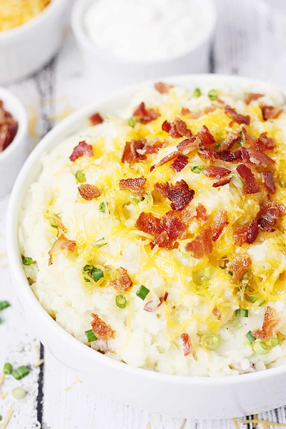 Instant Pot Mashed Potatoes with Cheddar Bacon and Onion -- Instant Pot mashed potatoes with cheddar, bacon and onion are my new favorite side dish. They're creamy, packed with delicious flavors, and an ideal Instant Pot recipe for newbies! | halfscratched.com #halfscratched #instantpot #pressurecooker #recipe