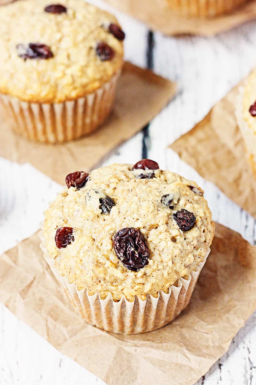 Oatmeal Raisin Cake Mix Muffins -- Bake a batch of these oatmeal raisin cake mix muffins and see if your family doesn't eat them in record time. Don't like raisins? Try mini chocolate chips or craisins instead! | halfscratched.com #recipe #breakfast