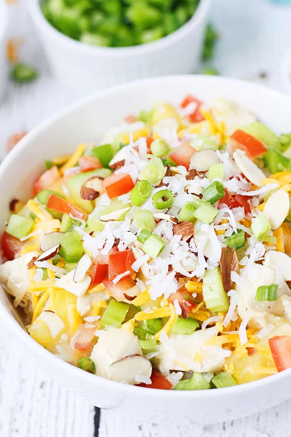 Easy Hawaiian Haystacks -- These easy Hawaiian haystacks area a favorite family meal! A creamy chicken mixture is layered over rice and then topped with a variety of ingredients, from cheese and chopped celery to bell peppers and pineapple. | halfscratched.com