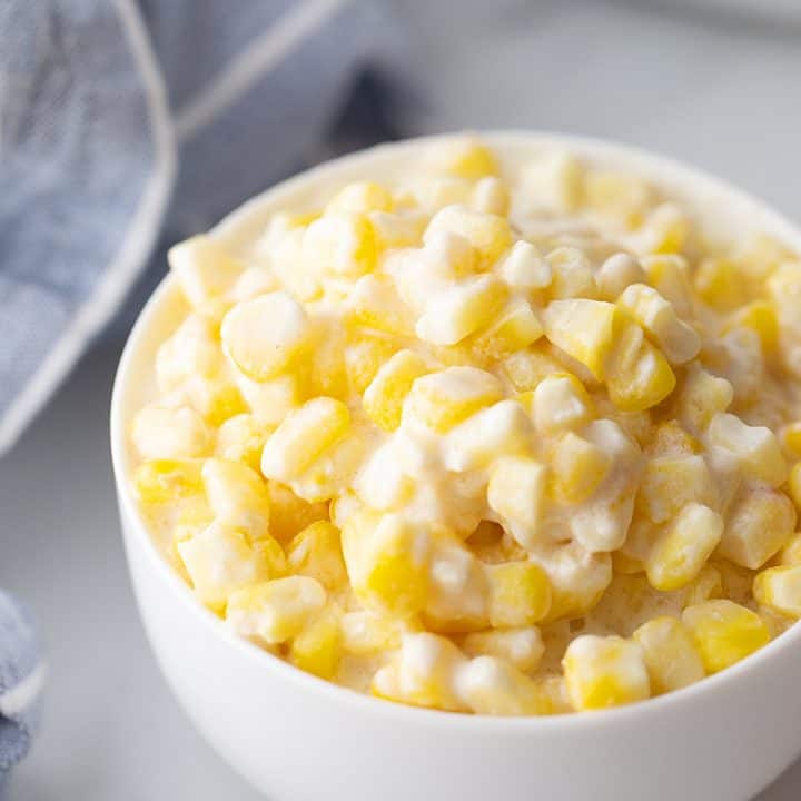 Easy Slow Cooker Creamed Corn - Ready for a side dish that's sure to please everyone? Try this easy, creamy, extra yummy slow cooker creamed corn! #creamedcorn #crockpot #slowcooker #sidedish #easyrecipe #slowcookercreamedcorn #corn #halfscratched