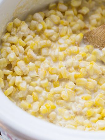Easy Slow Cooker Creamed Corn - Ready for a side dish that's sure to please everyone? Try this easy, creamy, extra yummy slow cooker creamed corn! #creamedcorn #crockpot #slowcooker #sidedish #easyrecipe #slowcookercreamedcorn #corn #halfscratched