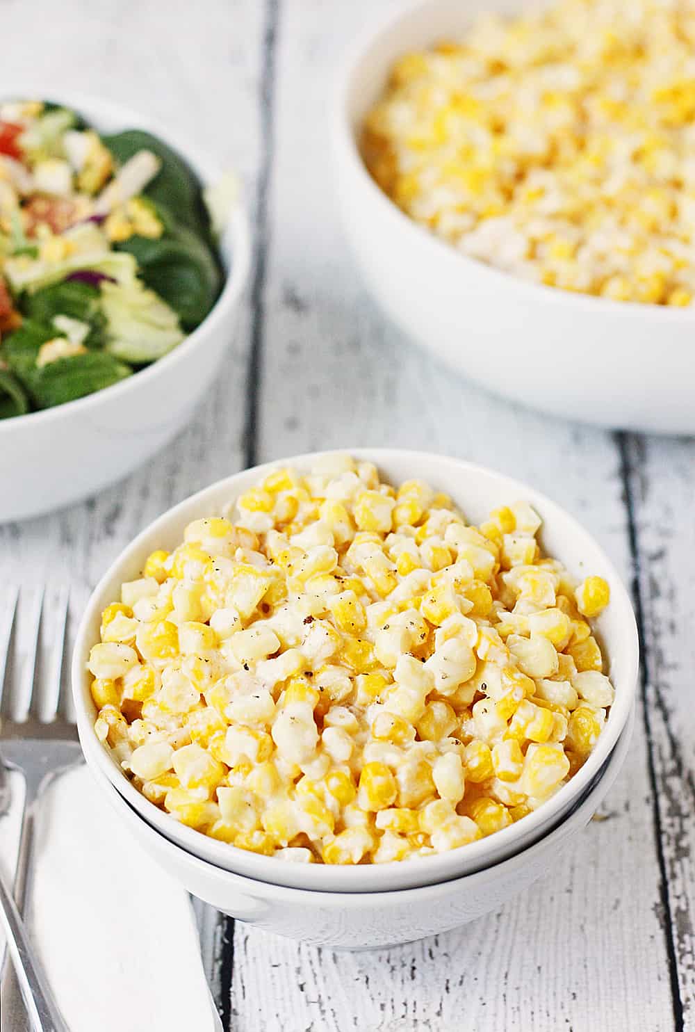 Low-Fat Slow Cooker Creamed Corn -- This low-fat slow cooker creamed corn is a lighter version of our family's favorite creamy, corny, extra yummy side dish! | halfscratched #recipe #sidedish #healthyrecipe