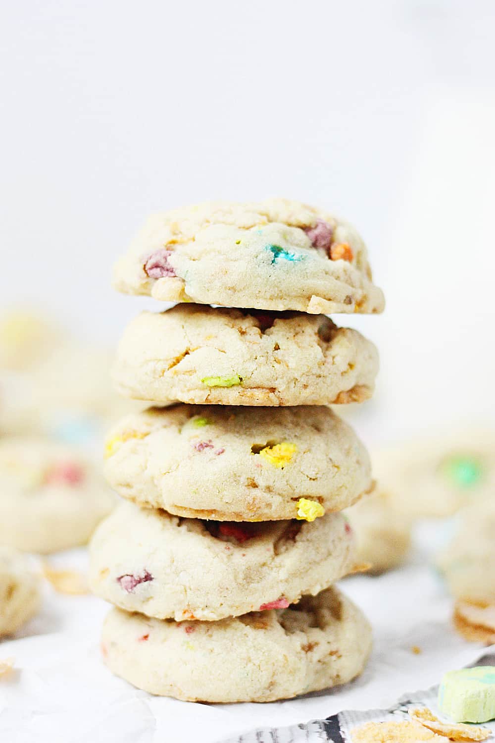 Lucky Charms Frosted Flakes Cookies --Lucky Charms Frosted Flakes cookies are soft and chewy with a hint of crunch and a smattering of sweet thanks to those crispy flakes and colorful marshmallows. | halfscratched.com