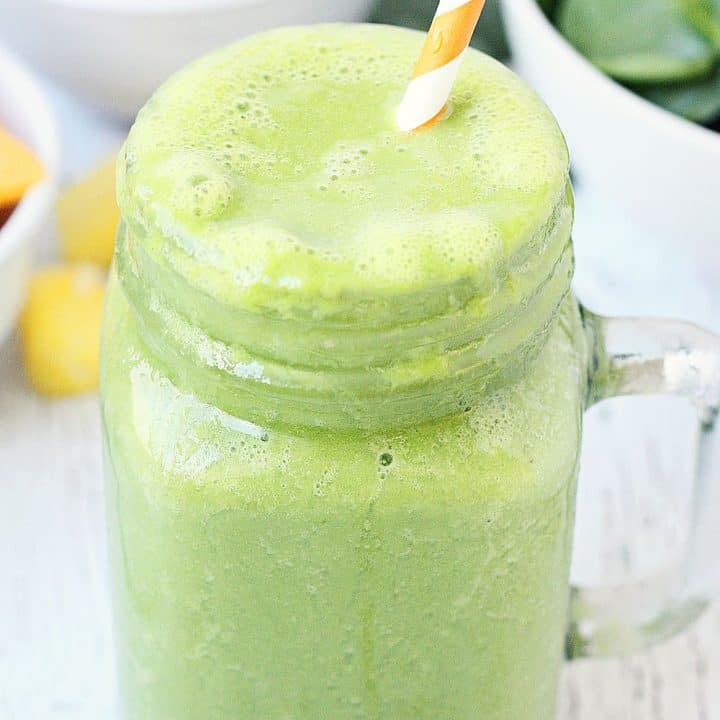 Pineapple Peach Green Smoothie -- This pineapple peach green smoothie is packed with good-for-you ingredients and good-for-your-taste-buds flavor. Frozen pineapple and peaches make it sweet while spinach and protein make it extra healthy! | halfscratched #ad #smoothie #recipe #drink