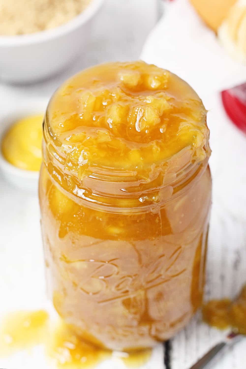 Warm Pineapple Sauce in a glass jar.