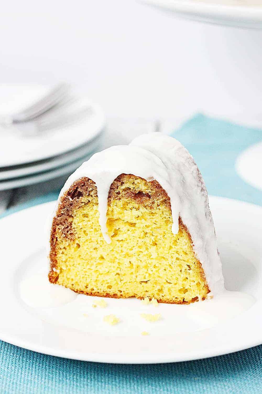 Closeup of a slice of cake mix coffee cake bundt cake with vanilla glaze 