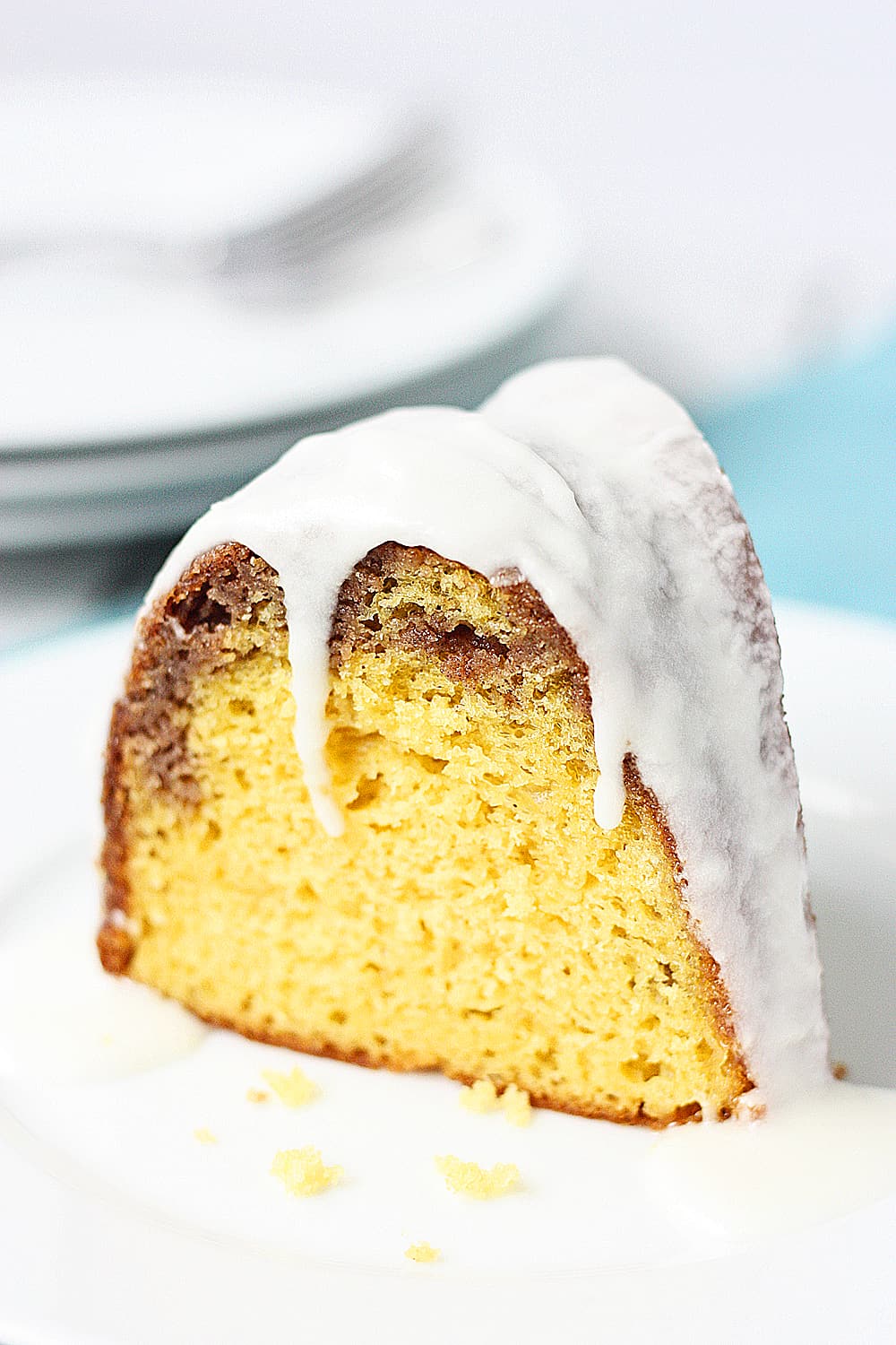 Closeup of a slice of cake mix coffee cake bundt cake with vanilla glaze 