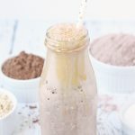 Healthy Chocolate Caramel Peanut Butter Smoothie -- This healthy chocolate caramel peanut butter smoothie tastes like dessert! Change up that ol' chocolate protein shake by adding sugar-free caramel syrup, peanut butter powder, and a pinch of kosher sea salt. | halfscratched.com #smoothie #chocolate #peanutbutter #proteinshake