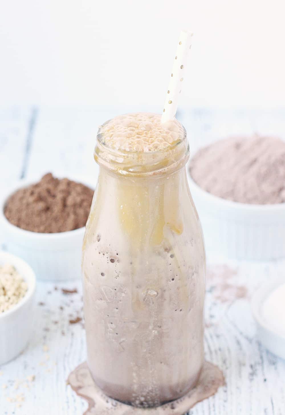 Healthy Chocolate Caramel Peanut Butter Smoothie -- This healthy chocolate caramel peanut butter smoothie tastes like dessert! Change up that ol' chocolate protein shake by adding sugar-free caramel syrup, peanut butter powder, and a pinch of kosher sea salt. | halfscratched.com #smoothie #chocolate #peanutbutter #proteinshake