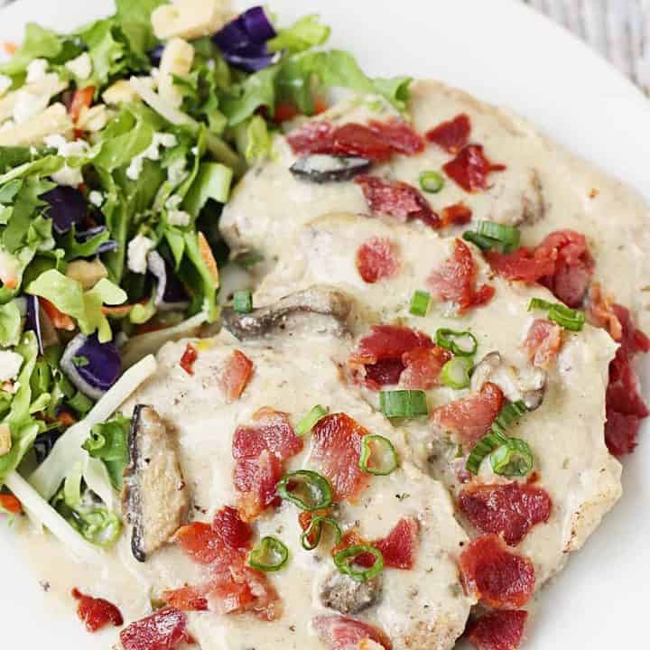 Instant Pot Pork Chops with Mushroom Gravy -- These Instant Pot pork chops with mushroom gravy require only a handful of ingredients and take about 30 minutes. Mushroom pork chops in the pressure cooker make for an easy weeknight meal the entire family will love! #pork #porkchops #instantpot #pressurecooker #easyrecipe #mushroomgravy #gravy #quickrecipe #halfscratched