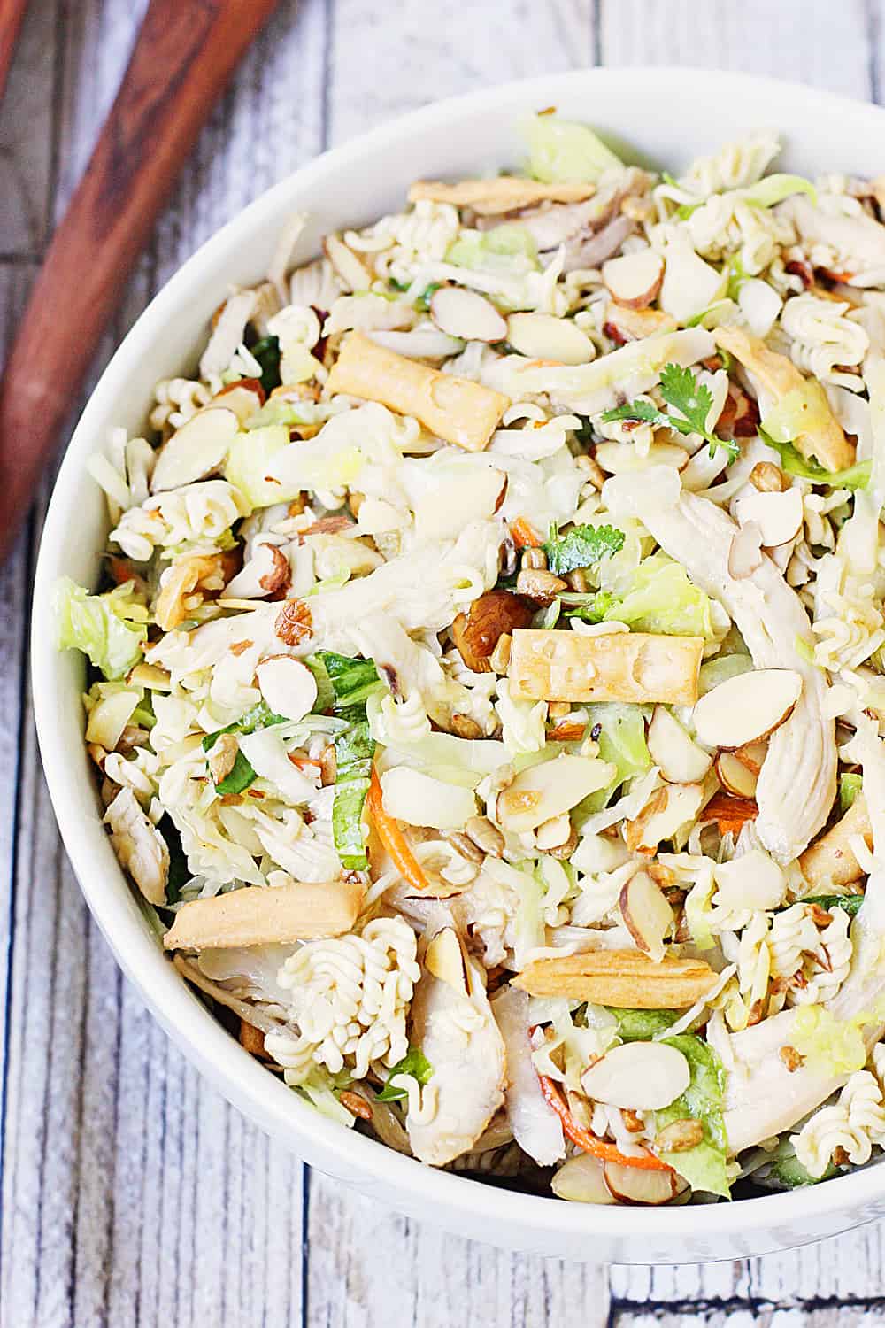 Easy Asian Ramen Salad -- My family LOVES this Asian ramen salad! An Asian salad kit + rotisserie chicken + a few simple ingredients equals the easiest Asian ramen noodle salad ever!