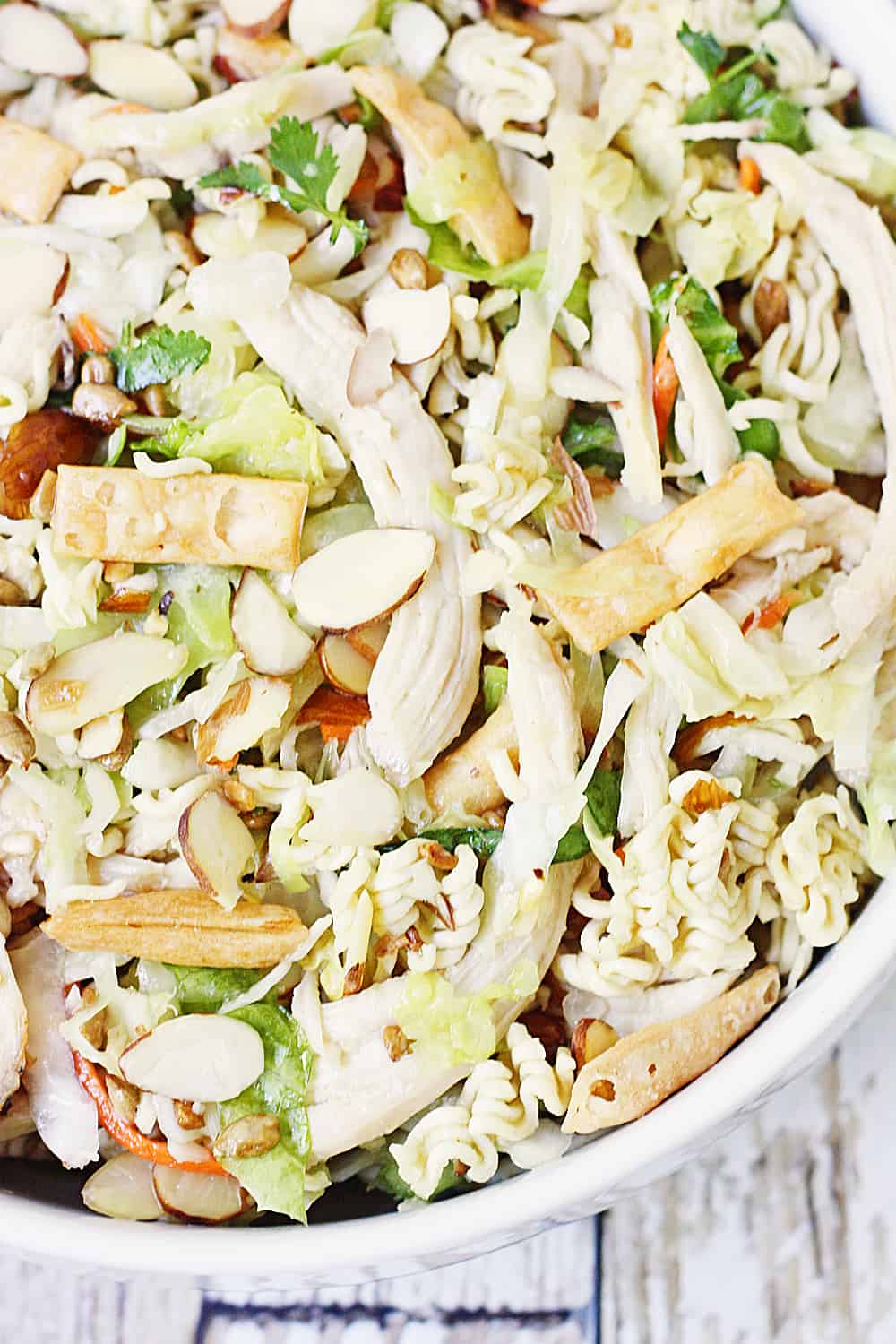 Easy Asian Ramen Salad -- My family LOVES this Asian ramen salad! An Asian salad kit + rotisserie chicken + a few simple ingredients equals the easiest Asian ramen noodle salad ever!