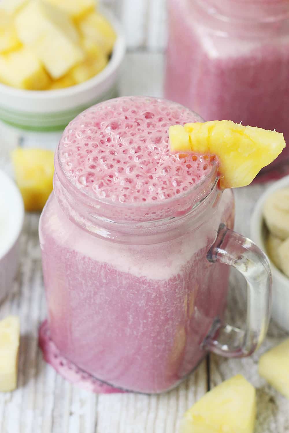 4-Ingredient Pineapple Cranberry Smoothie -- Cranberry lovers will enjoy this 4-ingredient pineapple cranberry smoothie! It features all-natural cranberry juice, frozen pineapple and banana, and Greek yogurt for a tart, good-for-you smoothie!