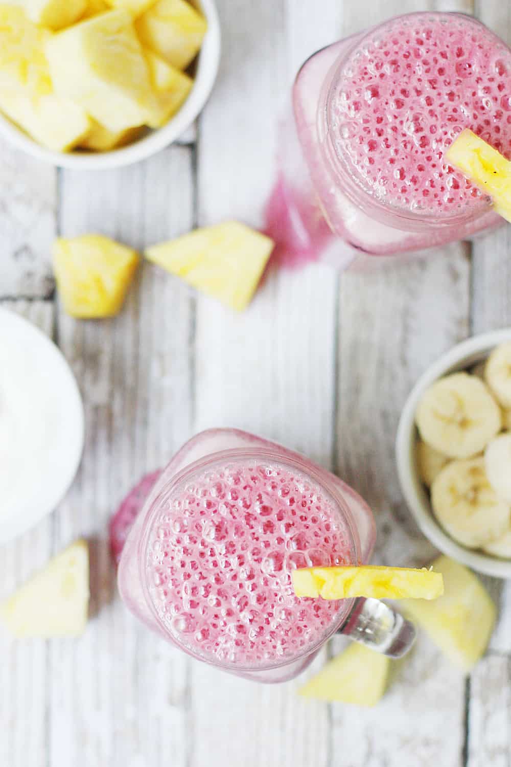 4-Ingredient Pineapple Cranberry Smoothie -- Cranberry lovers will enjoy this 4-ingredient pineapple cranberry smoothie! It features all-natural cranberry juice, frozen pineapple and banana, and Greek yogurt for a tart, good-for-you smoothie! #smoothie #cranberry #whatsyourjuicemadeof @walmart #KnudsenFarmToBottle #pineapple #drink #healthyrecipe #ad