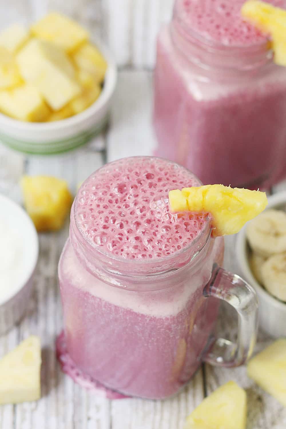 4-Ingredient Pineapple Cranberry Smoothie -- Cranberry lovers will enjoy this 4-ingredient pineapple cranberry smoothie! It features all-natural cranberry juice, frozen pineapple and banana, and Greek yogurt for a tart, good-for-you smoothie!