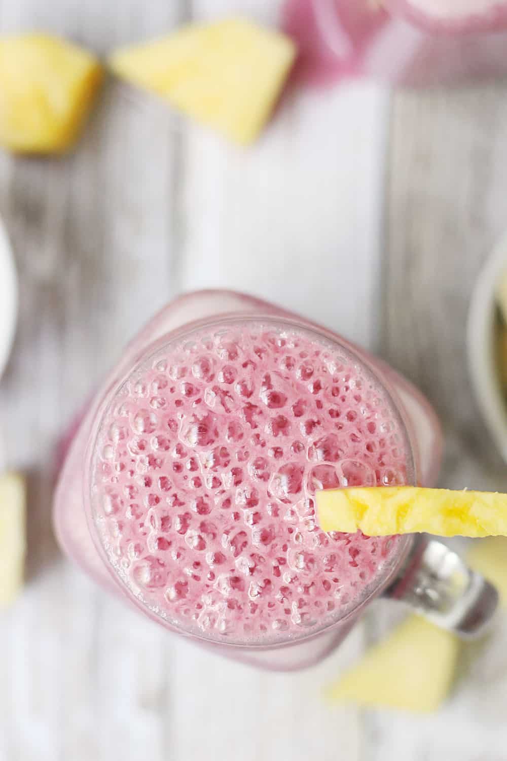 4-Ingredient Pineapple Cranberry Smoothie -- Cranberry lovers will enjoy this 4-ingredient pineapple cranberry smoothie! It features all-natural cranberry juice, frozen pineapple and banana, and Greek yogurt for a tart.