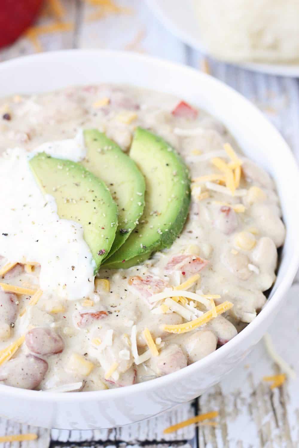 Easy Vegetarian White Bean Chili -- Busy weeknights call for yummy recipes like this easy vegetarian white bean chili. Bell pepper, onion, and corn make it extra hearty!