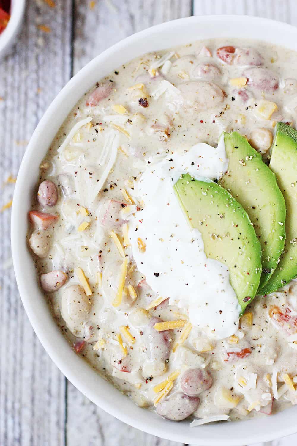 Easy Vegetarian White Bean Chili -- Busy weeknights call for yummy recipes like this easy vegetarian white bean chili. Bell pepper, onion, and corn make it extra hearty!