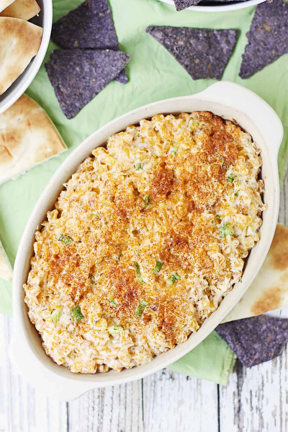 Easy Hot Corn Dip -- This hot corn dip recipe is rich, creamy, and full of flavor. It also comes together super quickly and is super delicious served with favorite crackers! #corndip #appetizer #hotappetizer #appetizerrecipe #halfscratched #corn #cornrecipe #holidayrecipe #cooking #recipe #easyrecipe