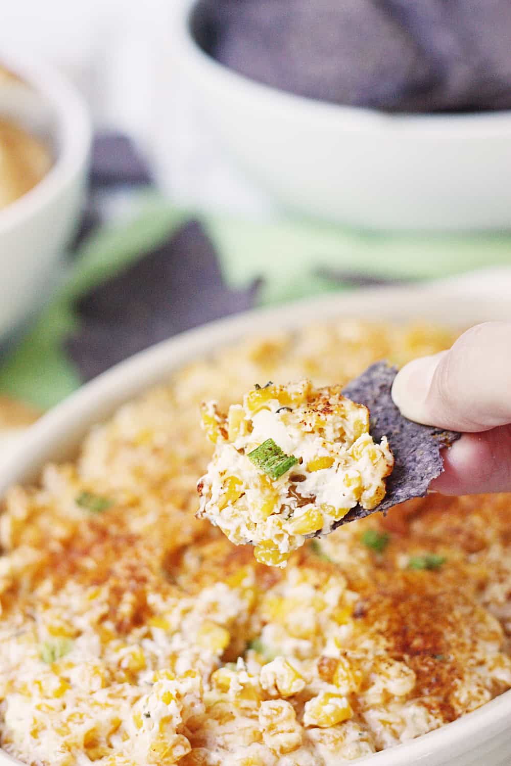 Easy Hot Corn Dip -- This hot corn dip recipe is rich, creamy, and full of flavor. It also comes together super quickly and is super delicious served with favorite crackers! #corndip #appetizer #hotappetizer #appetizerrecipe #halfscratched #corn #cornrecipe #holidayrecipe #cooking #recipe #easyrecipe