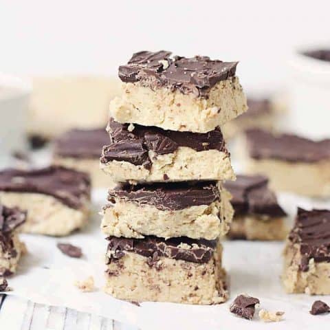 Quick & Easy No-Bake Peanut Butter Bars - Quick and easy no-bake peanut butter bars are always a hit! They require only five ingredients and a few minutes to prep... and even less time to devour! #peanutbutter #easy #easyrecipe #chocolate #reeses #nobake #nobakerecipe #dessert #nobakedessert #baking #halfscratched #freezerrecipe